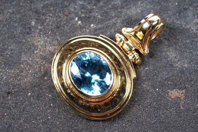 Lot 519 - A "Swiss" blue topaz pendant on 18ct gold