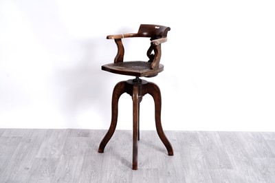 Lot 40 - A Victorian beech adjustable child’s swivel armchair