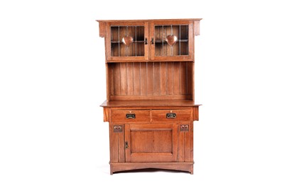Lot 611 - An early 20th Century Arts and Crafts oak dresser