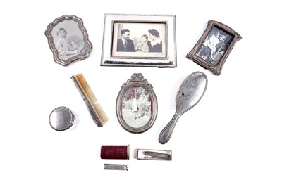 Lot 518 - Silver and silverplate, to include: photograph frames; and a Dunhill lighter
