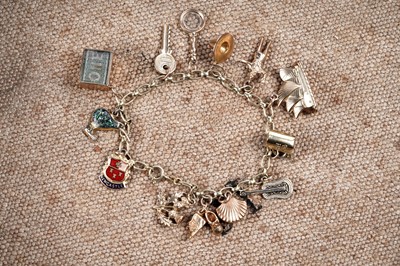 Lot 314 - A gold charm bracelet