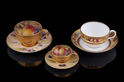 Lot 412 - Three Royal Worcester fruit painted cups and saucers