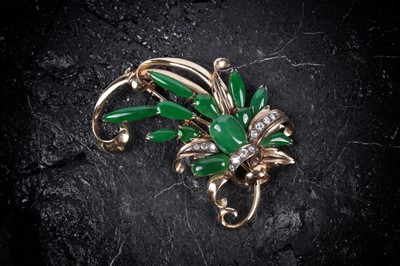 Lot 323 - A jadeite and diamond stylized floral spray brooch