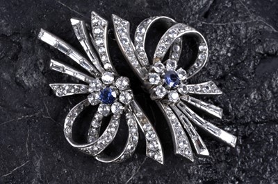 Lot 225 - A pair of early 20th Century synthetic sapphire and white spinel dress brooches