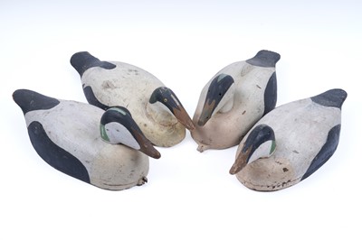 Lot 276 - A collection of four early 20th Century carved and painted decoy ducks