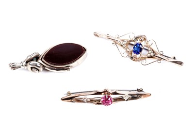 Lot 228 - An early 20th Century 9ct gold swivel fob seal; and two bar brooches