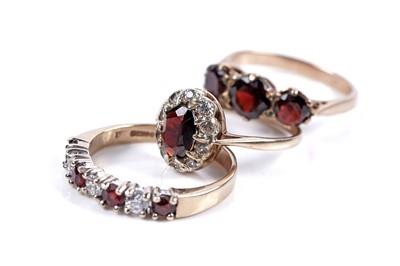 Lot 279 - Three garnet rings of various designs