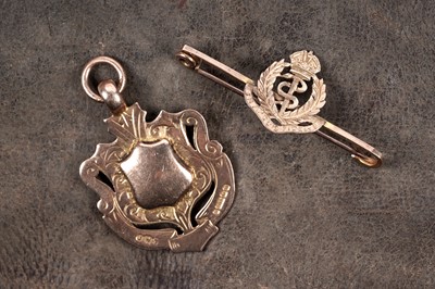 Lot 301 - A George V 9ct rose gold fob medallion; and a Royal Army Medical Corps sweetheart brooch