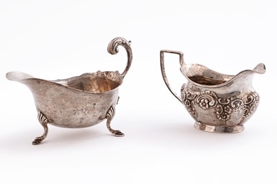 Lot 549 - An Edwardian silver cream jug; and a later sauce jug