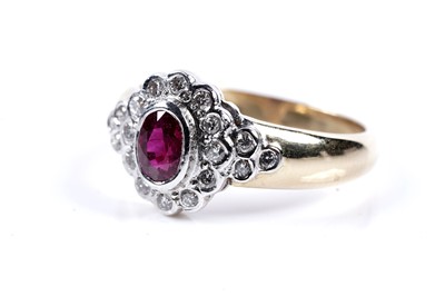 Lot 144 - A ruby and diamond dress ring