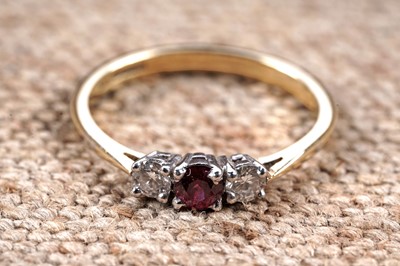Lot 151 - A contemporary ruby and diamond three-stone ring