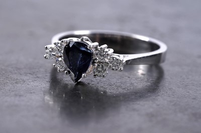 Lot 173 - A contemporary sapphire and diamond ring