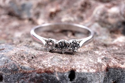 Lot 180 - A three-stone diamond ring