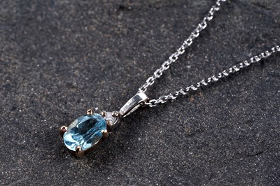 Lot 190 - A topaz and diamond pendant necklace