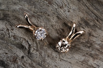 Lot 196 - Two solitaire diamond pendants