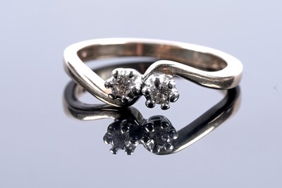 Lot 200 - A two stone diamond ring