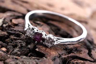 Lot 209 - A three-stone ruby and diamond ring