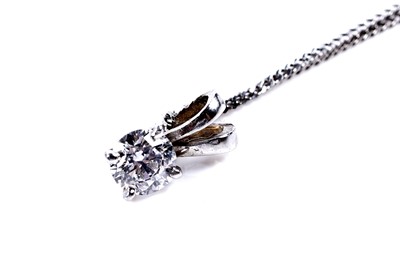 Lot 551 - A solitaire diamond pendant necklace