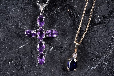 Lot 216 - A sapphire and diamond pendant necklace; and an amethyst cruciform pendant on chain