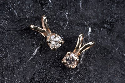 Lot 221 - Two solitaire diamond pendants