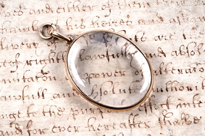 Lot 224 - An early 20th Century 15ct gold and rock crystal pendant locket