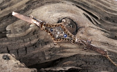 Lot 100 - A 1913 diamond and blue paste bar brooch