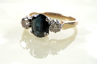 Lot 345 - A sapphire and diamond three-stone ring