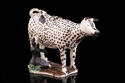 Lot 361 - A creamware cow creamer