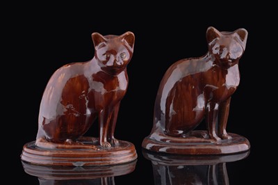 Lot 384 - Two treacle glazed cats