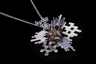 Lot 374 - A 1960's British Modernist pyrite geode and silver asteroid pattern pendant