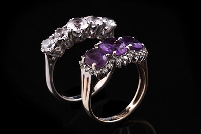 Lot 347 - An amethyst three-stone ring; and a five-stone zircon ring