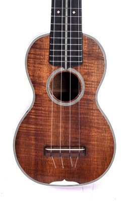 Lot 46 - A Martin style 3K soprano ukulele; and two cases, one original