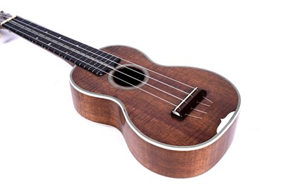 Lot 46 - A Martin style 3K soprano ukulele; and two cases, one original