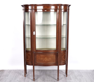 Lot 45 - Ray & Miles, Liverpool: an Edwardian inlaid mahogany serpentine-fronted display cabinet