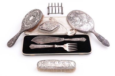 Lot 513 - Silver items including: a George IV silver ladle; and a toast rack