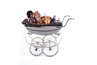 Lot 487 - A mid-20th Century Silver Cross pram containing a collection of loose toys
