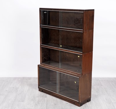 Lot 85 - Minty: a mahogany sectional waterfall bookcase