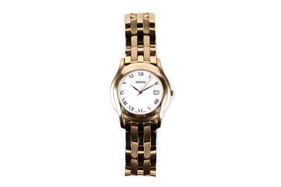 Lot 622 - A Gucci gold tone stainless steel wristwatch