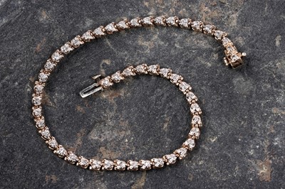 Lot 568 - A diamond line bracelet