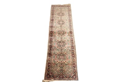 Lot 504 - A hand knotted silk Persian Tabriz runner