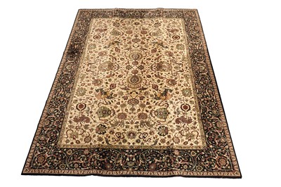 Lot 521 - A machine made Qum style carpet