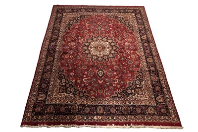 Lot 522 - A hand knotted Persian Mashad carpet
