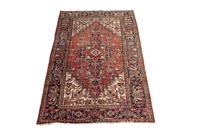 Lot 523 - An antique hand knotted Persian Heriz carpet