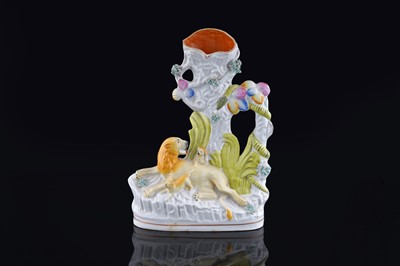 Lot 235 - A Staffordshire spill vase lion and cubs