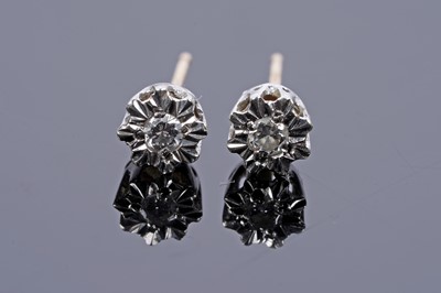 Lot 586 - A pair of diamond stud earrings