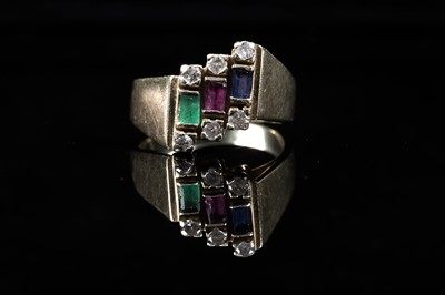 Lot 591 - A modern sapphire, emerald, ruby and diamond ring