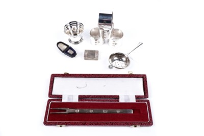 Lot 637 - A collection of silver, including: an Elizabeth II pickle fork; and four napkin rings