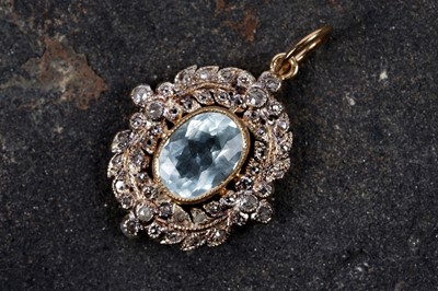 Lot 574 - An Edwardian style aquamarine and diamond pendant