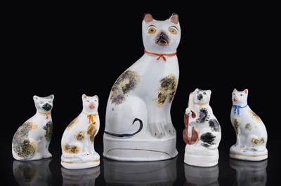 Lot 266 - Five Staffordshire cats