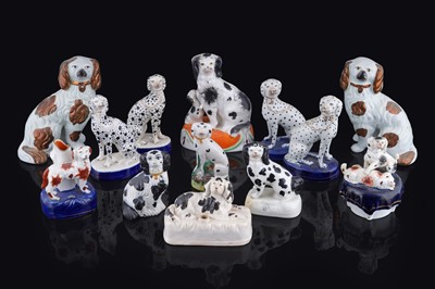 Lot 267 - A collection of Staffordshire Spaniels and Dalmatians